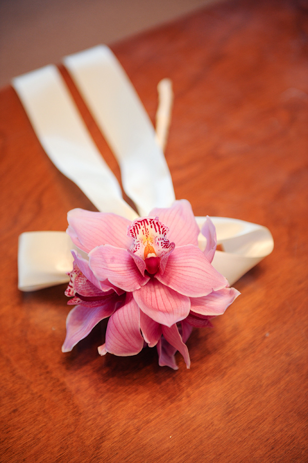 Pink orchid corsage with white ribbon - wedding photo by Kenny Nakai Photography
